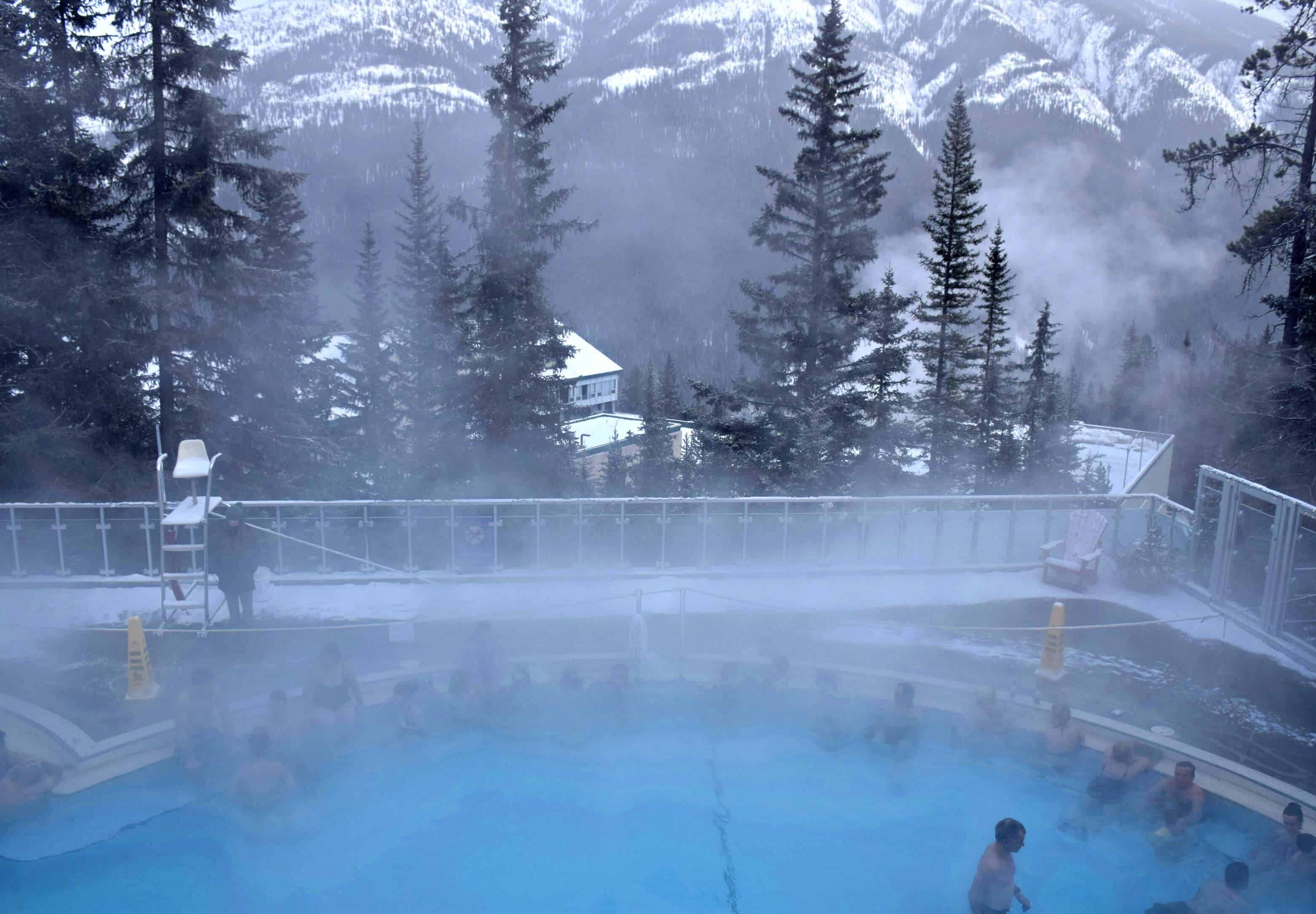 Banff Hot Springs pool with steam in winter in Banff National Park