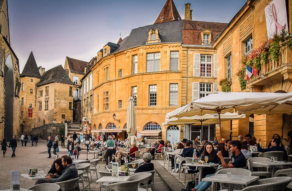 A busy cafe in the main square in Sarlat, France.