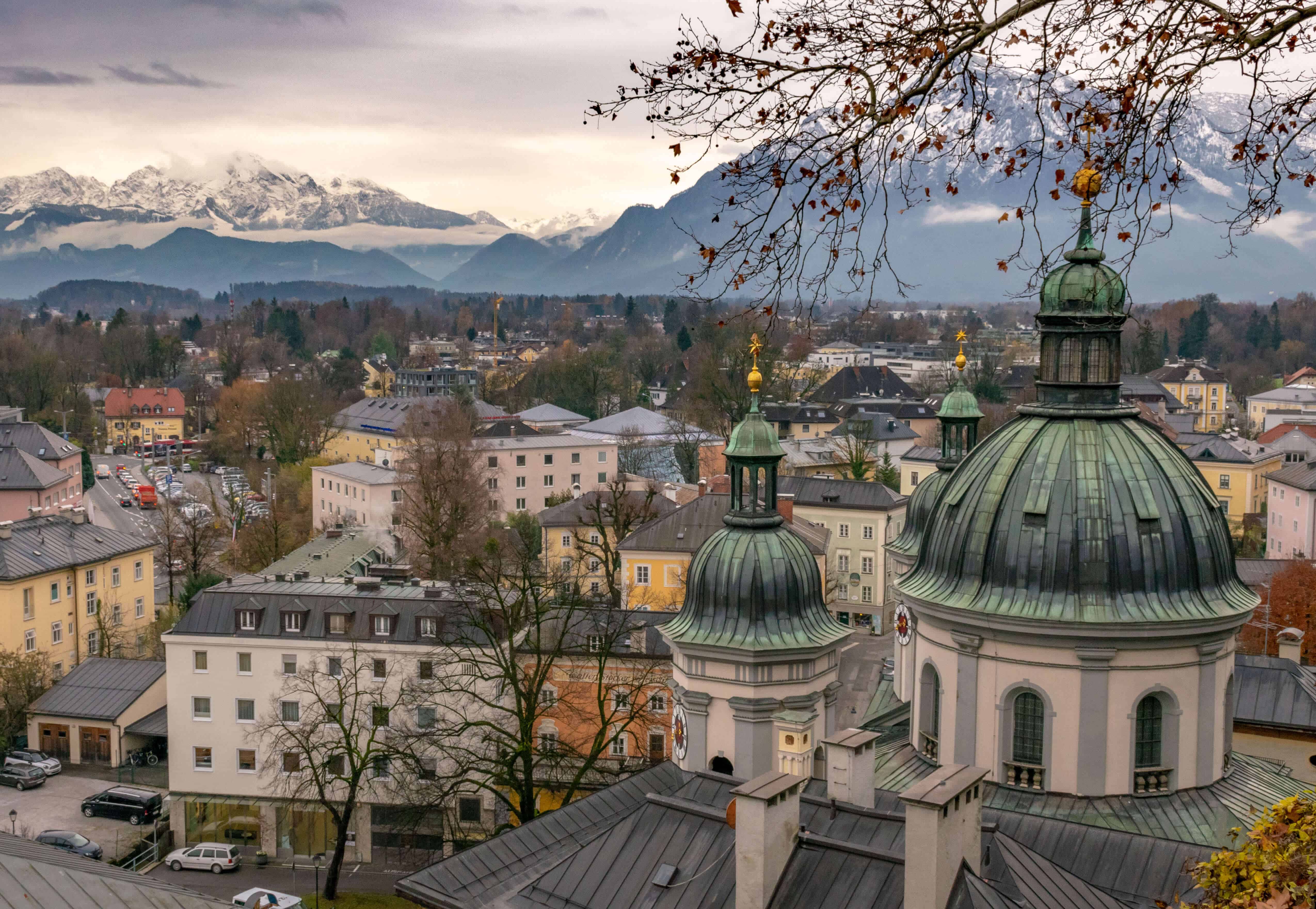 The view over Salzburg with snow-covered mountains in the background, a popular daytrip from Vienna