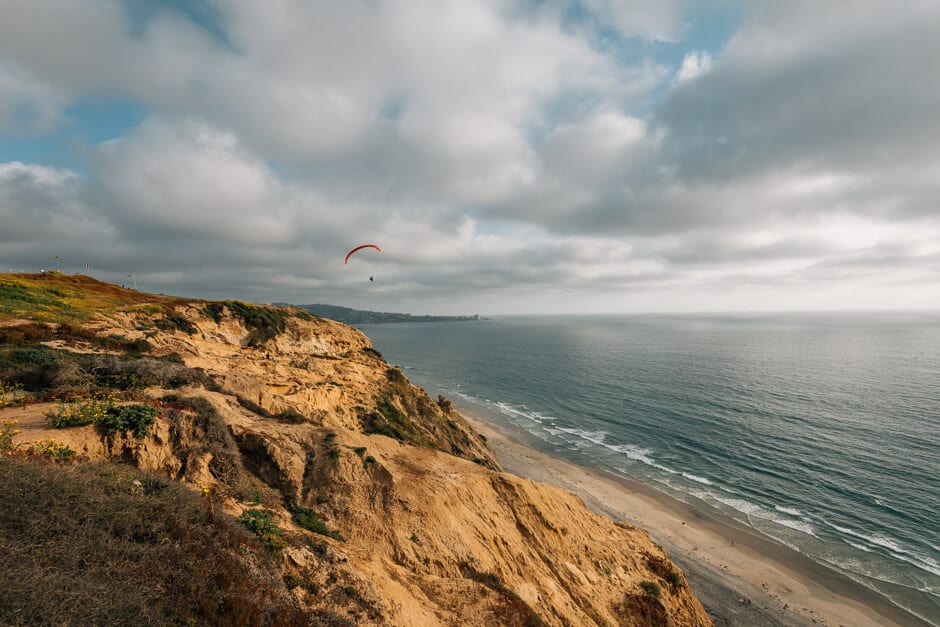 Hanglider off the cliffs and ocean at Torrey Pines State Reserve in California United States