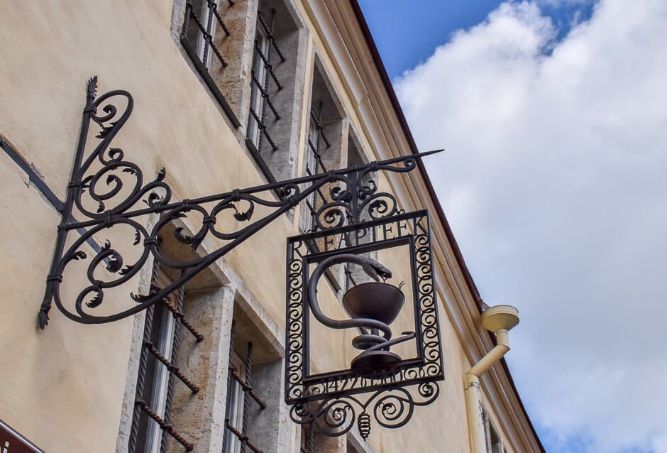 The hanging sign outside the Town Hall Pharmacy in Tallinn