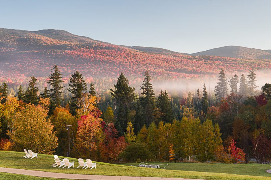 Chairs with a view of fall foliage and mist on Mount Washington, New Hampshire, best fall vacation in the U.S.