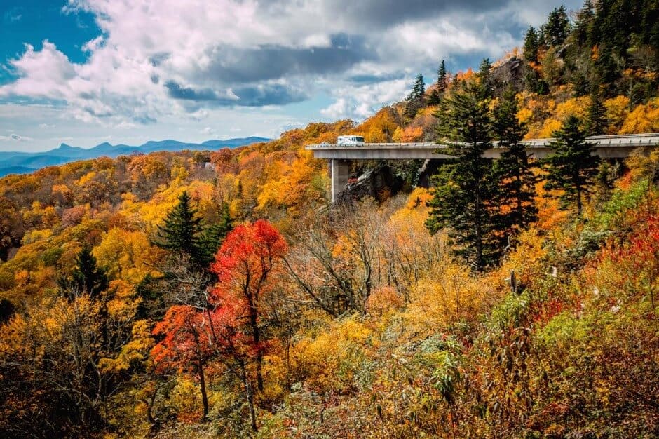 Vibrant fall foliage at the Linn Cove Viaduct in the Blue Ridge Parkway