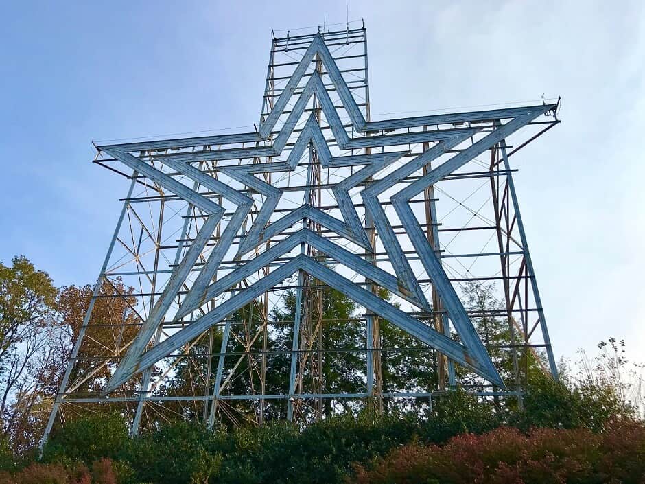A giant metallic star is held up by scaffolding in Roanoake Virginia