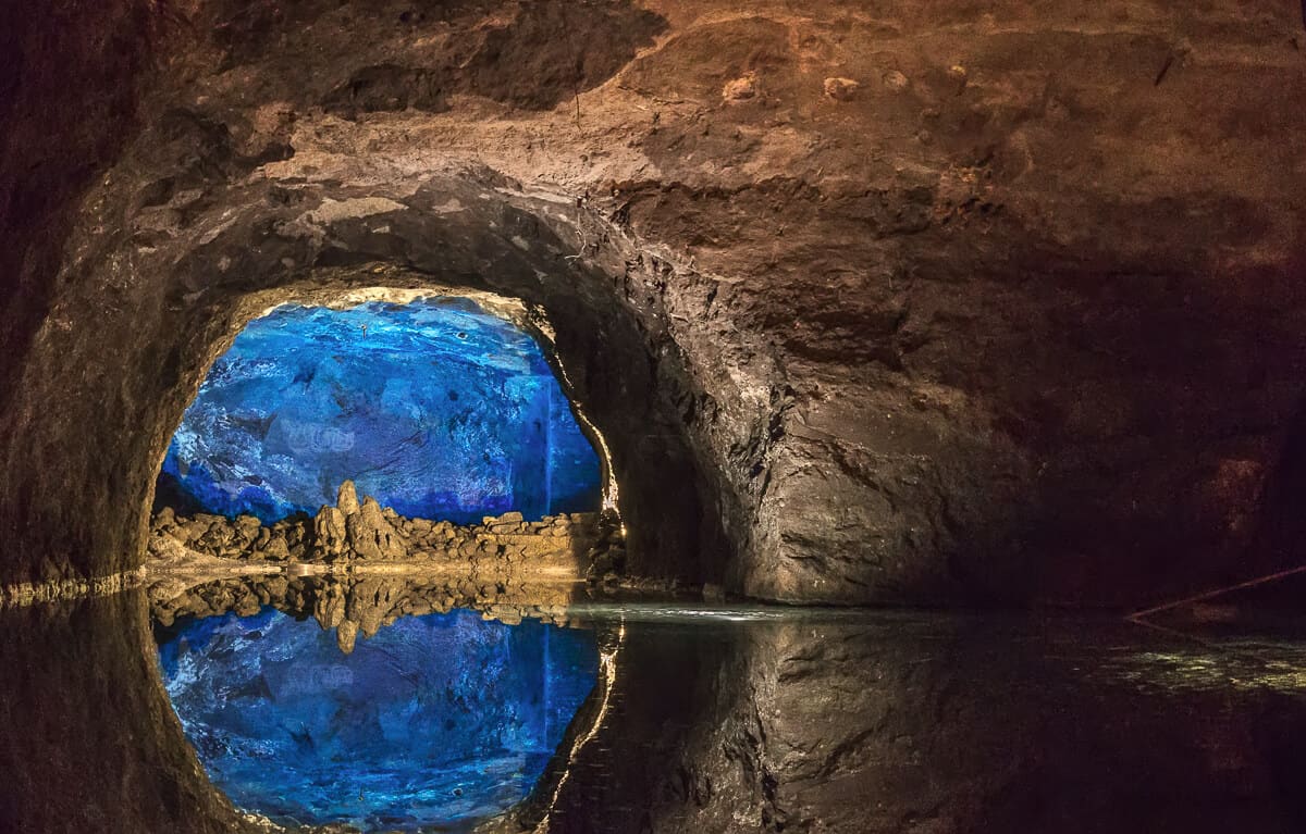 An underground grotto filled with blue water in the Vienna Woods, Austria