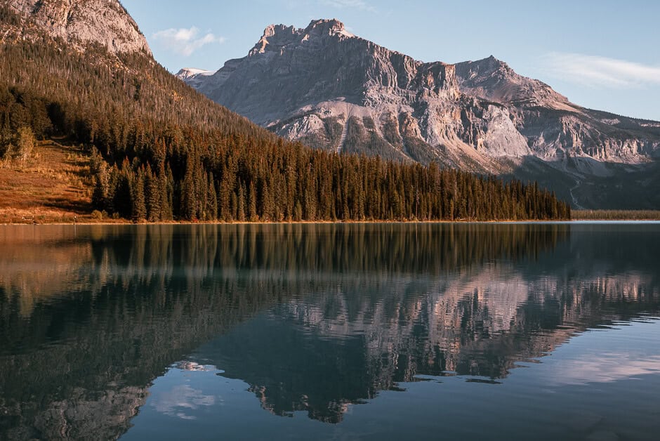 A mountain and trees reflecting in Emerald Lake in Yoho National Park in BC, Canada.